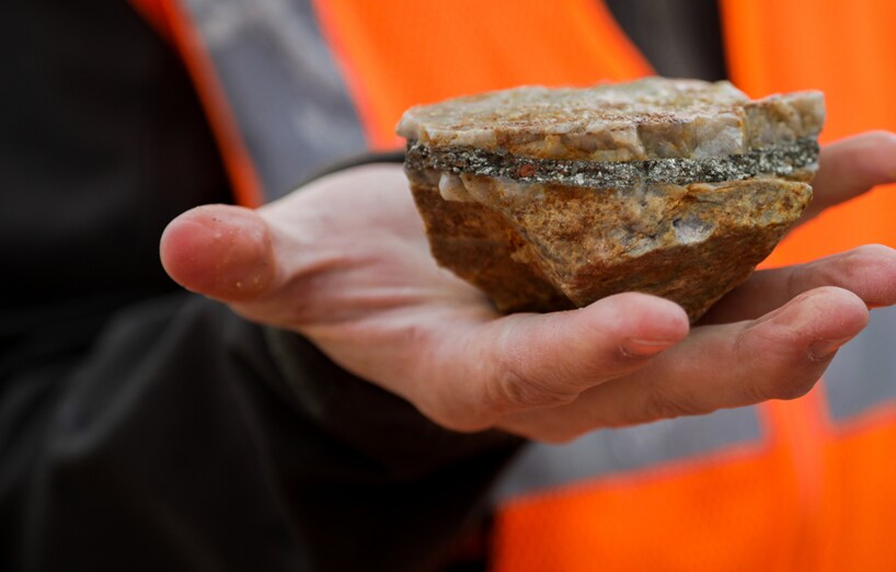 person holding rock