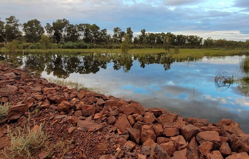 water next to rockbank