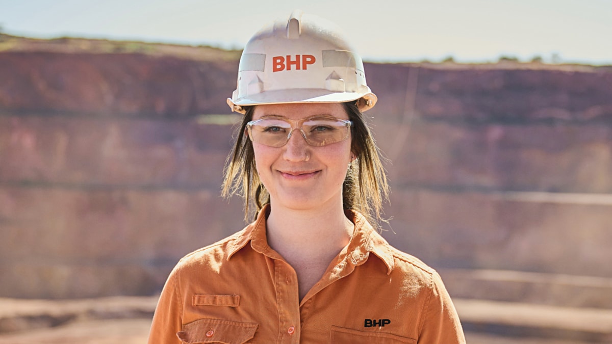 Rachel shown smiling with landscape in background