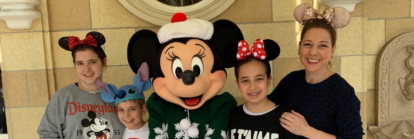 family photo with minnie mouse at disneyland