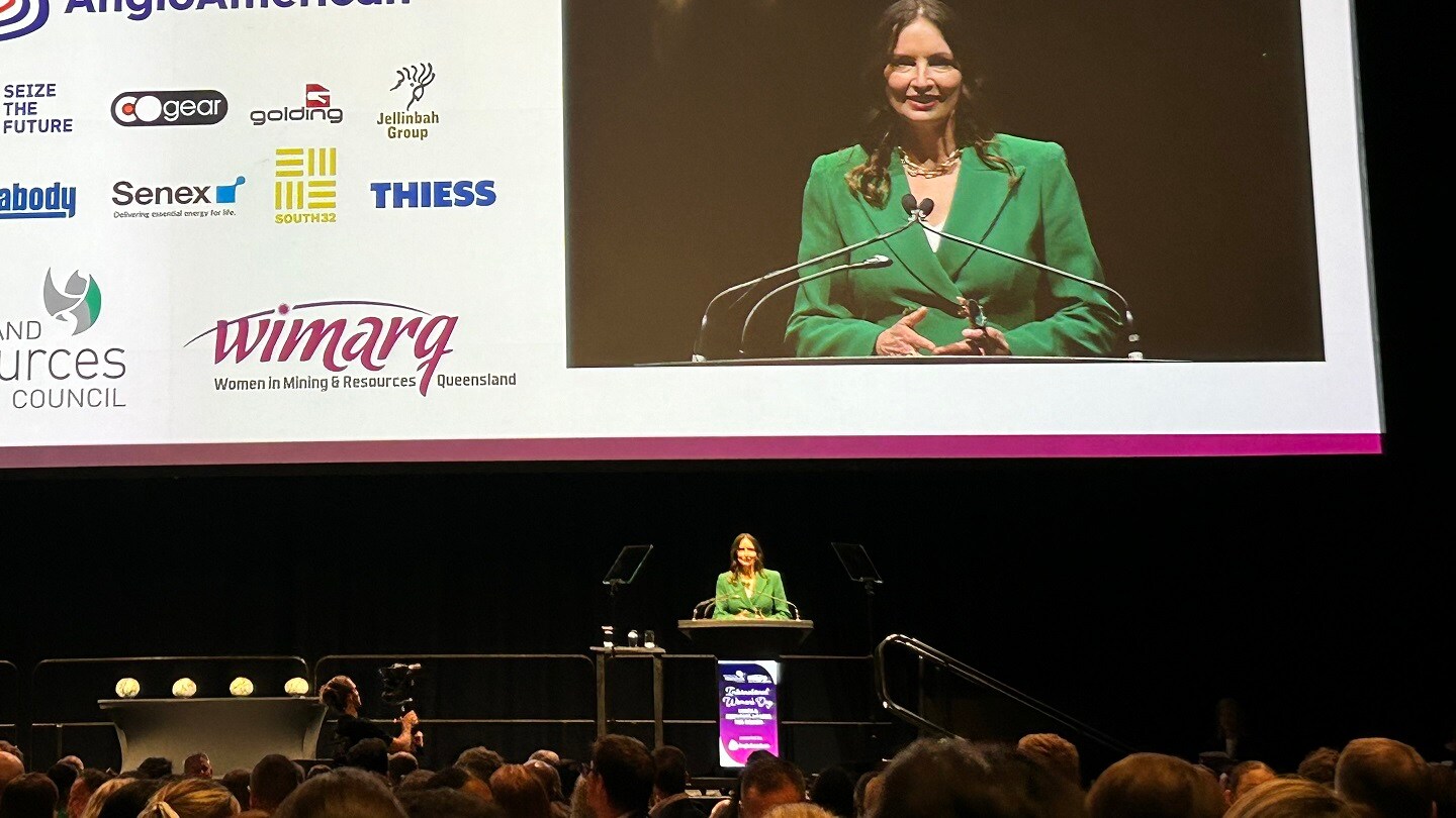 person speaking at conference