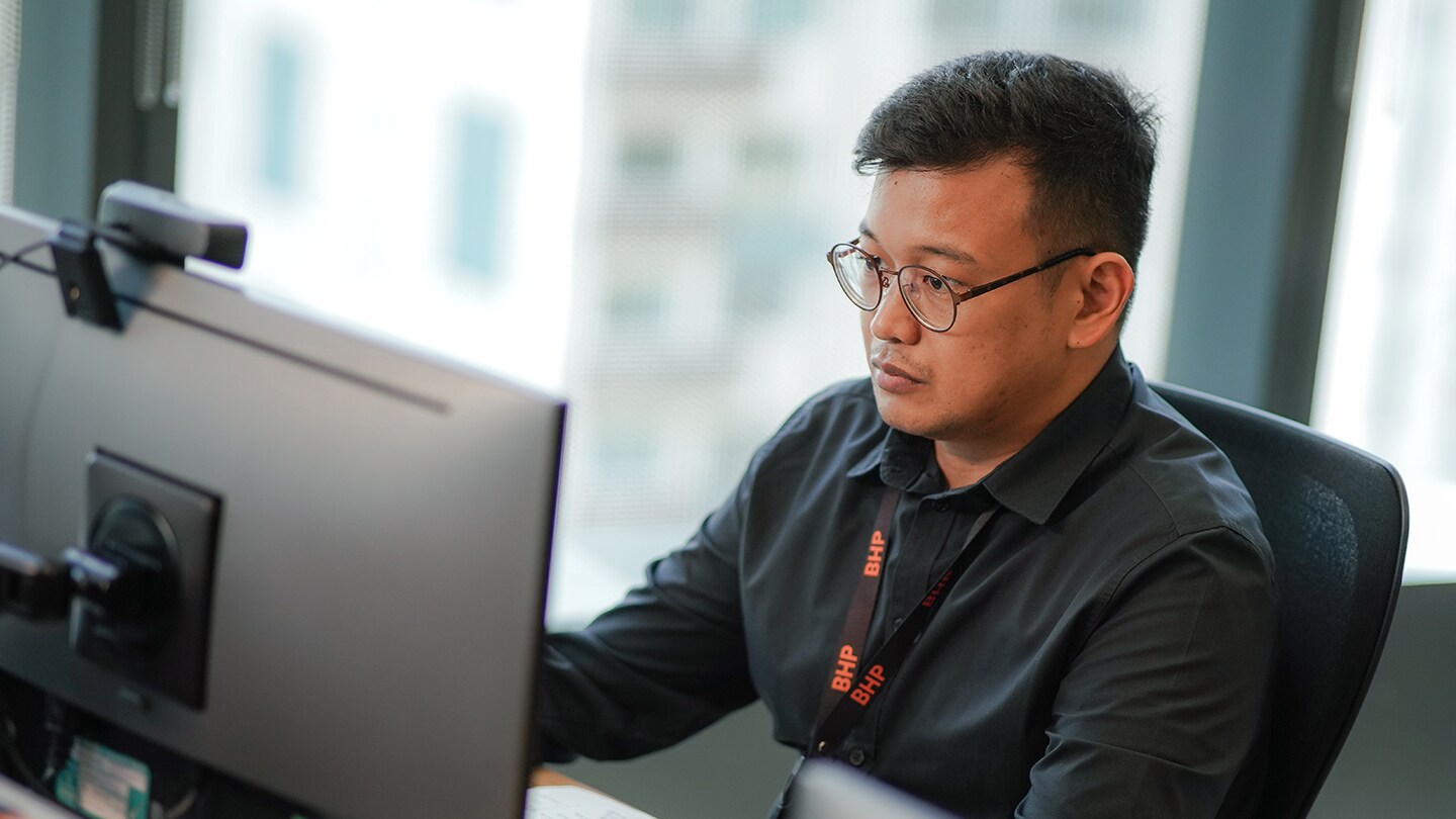 BHP person working at computer