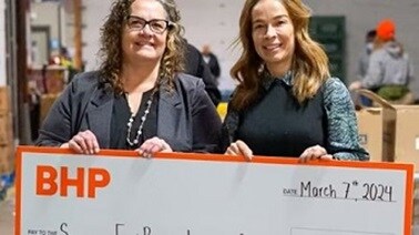 People holding giant cheque