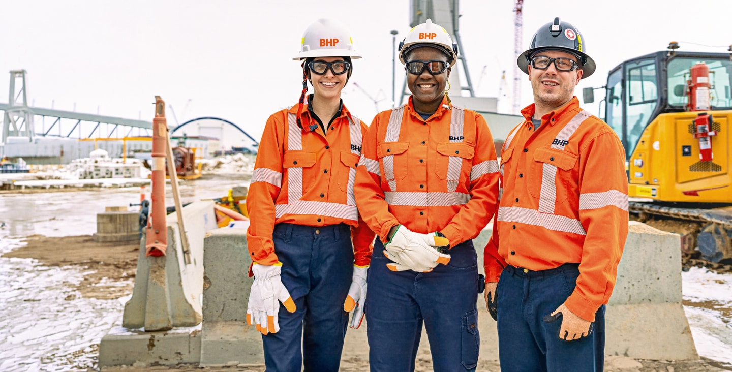 Three people standing at Jansen mine