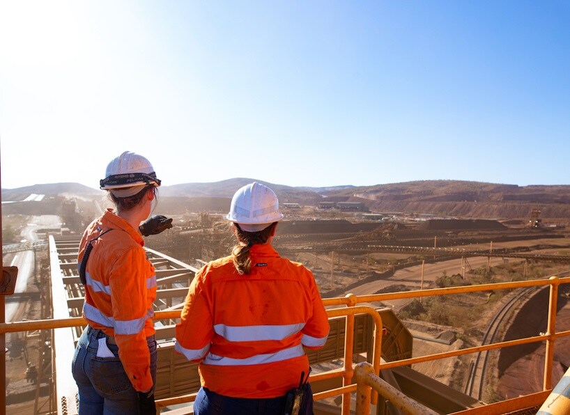 Workers looking out over a mine site