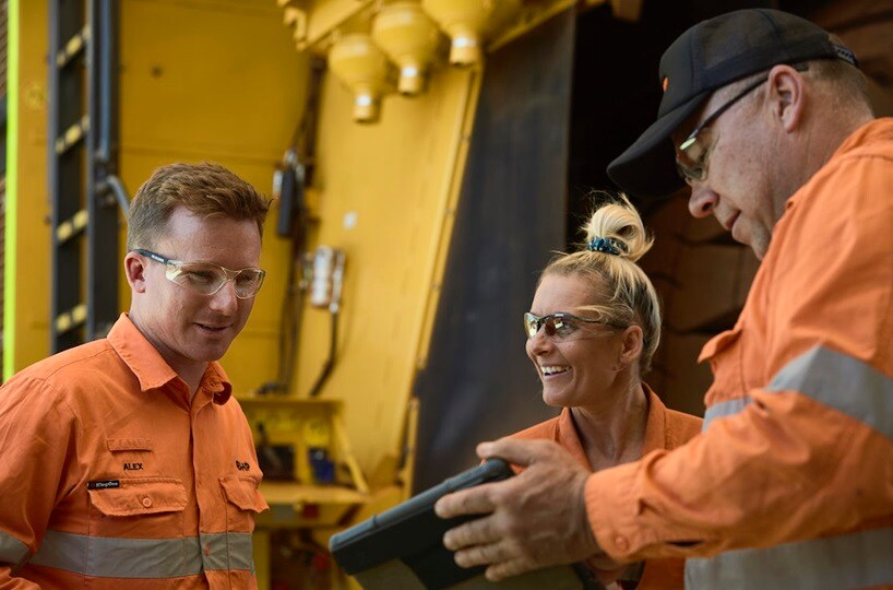 Workers talking in workshop