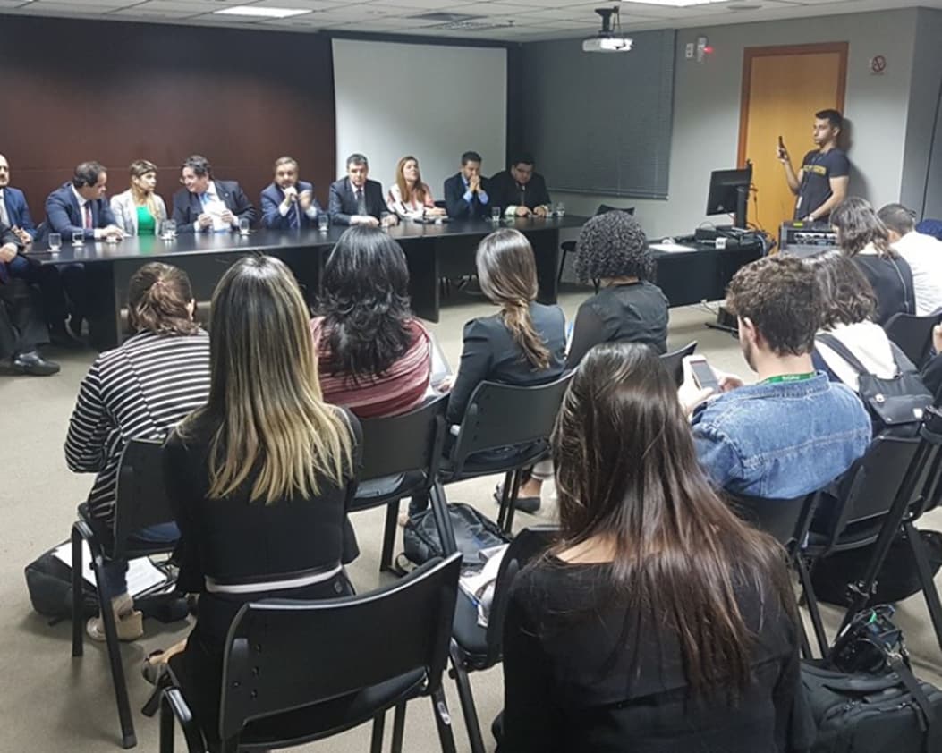 people in a room at a conference or meeting