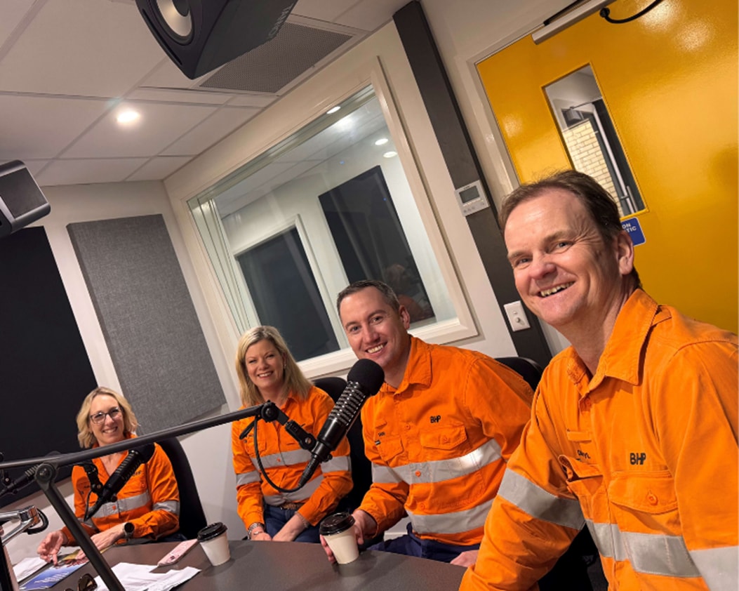 Panel of 4 BHP leadership people sat at table in recording studio to provide updates for a podcast
