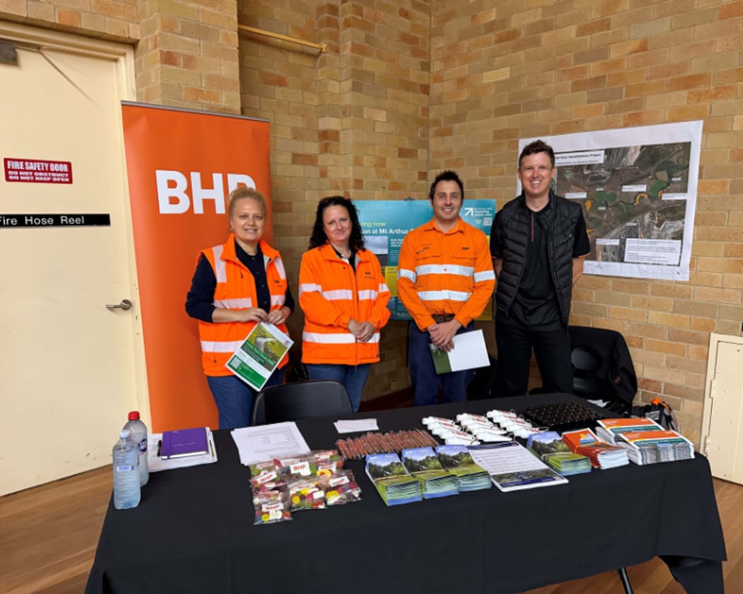 Mt Arthur Coal teammates standing at stall at the 2026 Hunter River Forum