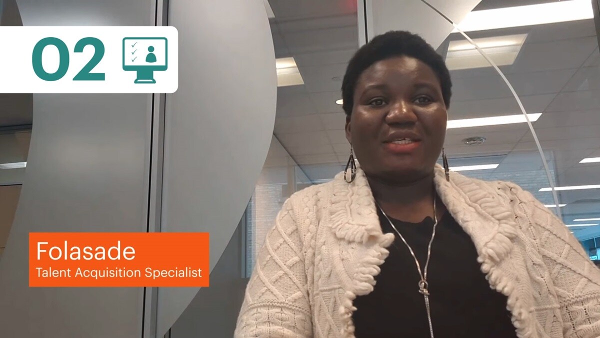 Step two recruitment process diagram and BHP Talent Acquisition specialist Folasade pictured sitting at desk