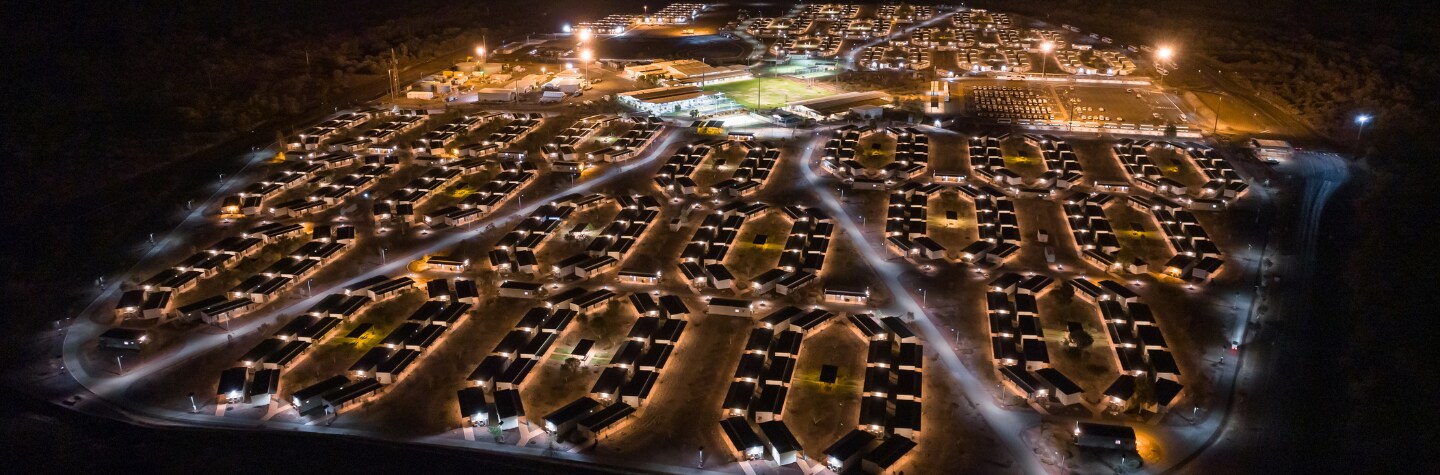230627_Aerial view of Warrawandu Village lit up at night