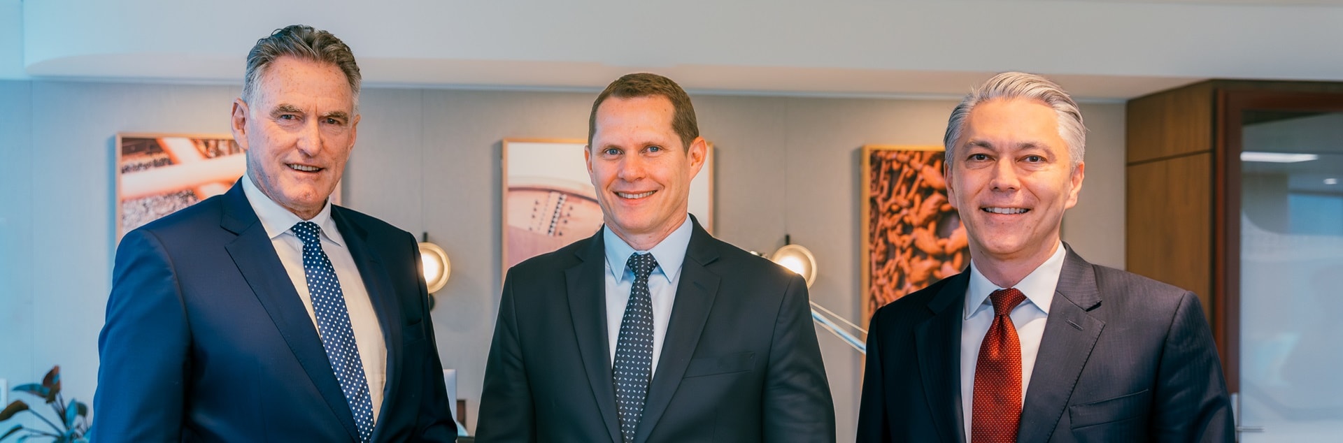 three people looking at camera