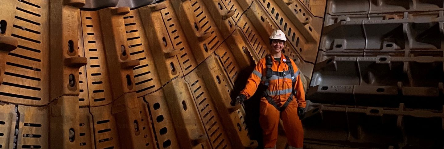 woman in mining uniform underground 