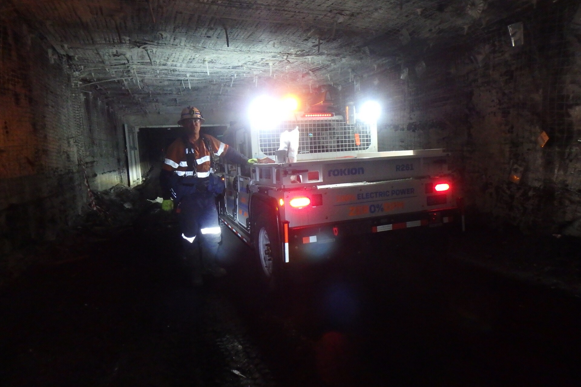 miner underground with vehicle