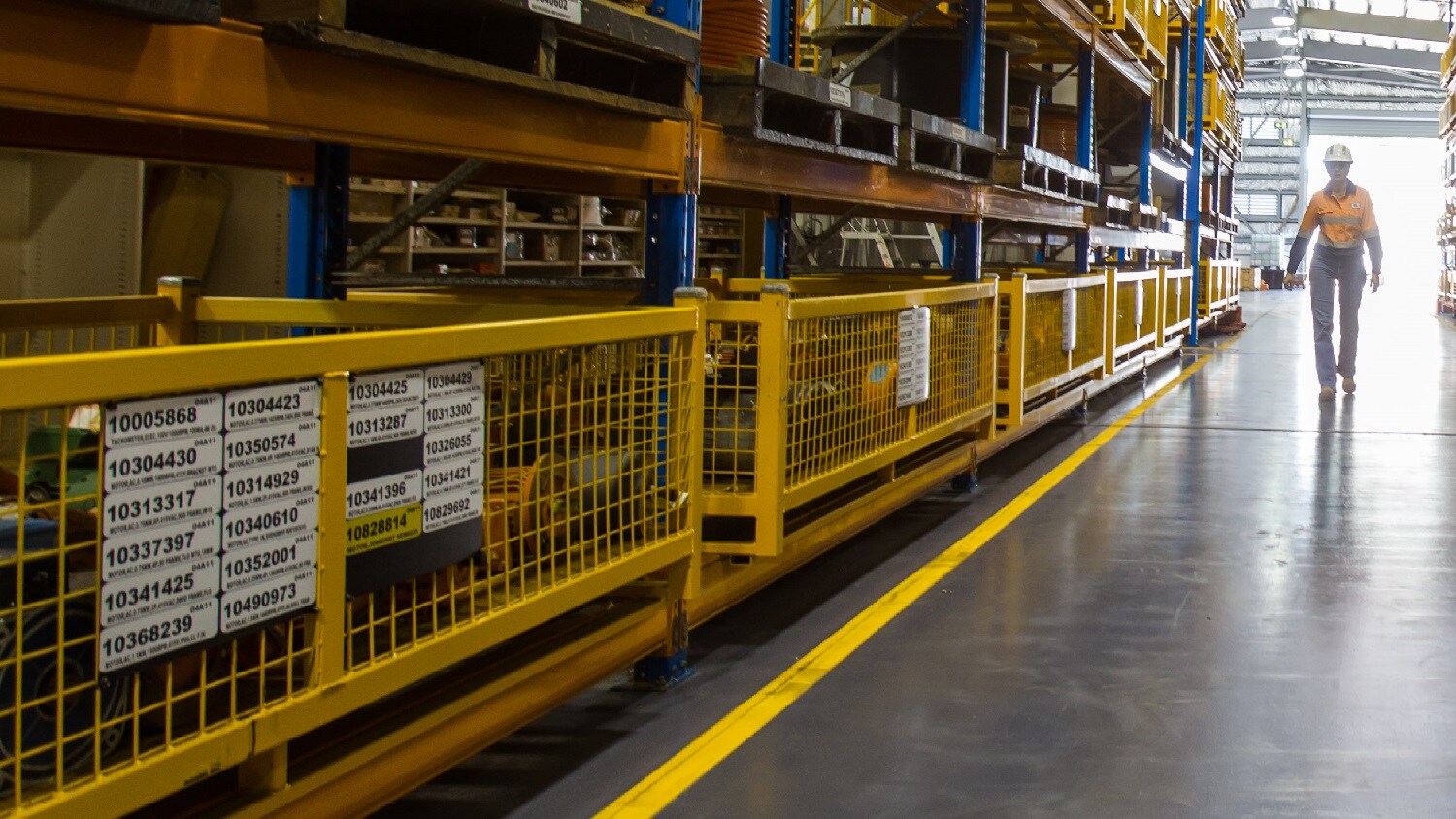 Image of a worker wearing PPE in a warehouse
