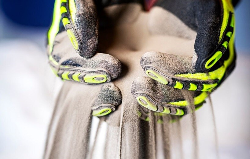 silt sifting through gloved hand