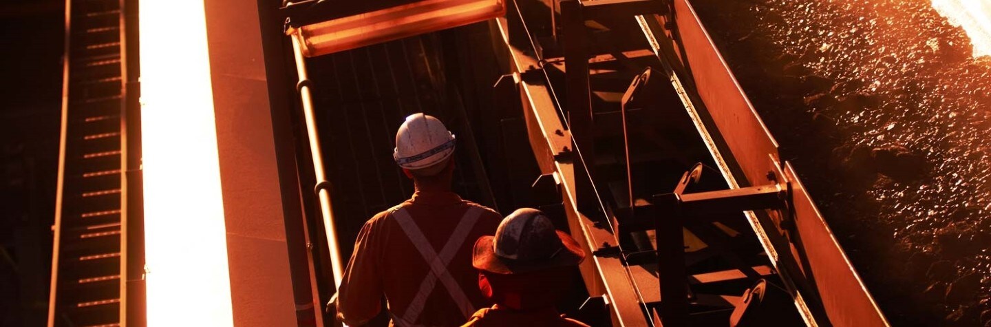 Two workers at a conveyor
