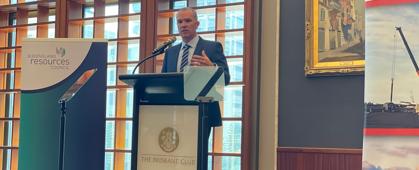 Adam Lancey speaking at a podium at Queensland Resources Media Awards