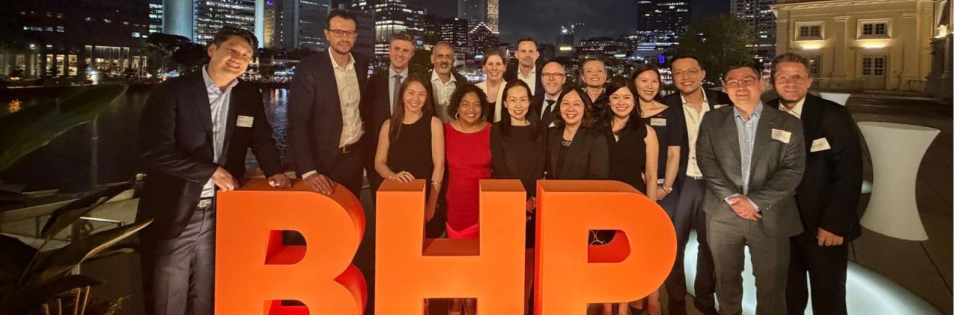 Team of employees in Singapore celebrating 25th anniversary 