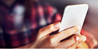 woman's hand holding a smartphone