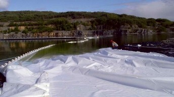 whitetarpbeinghauledintowatercatchment 2021