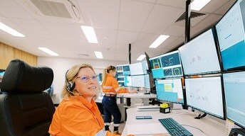 Person in front of screens