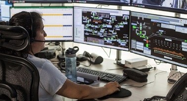 Person looking at computer screens