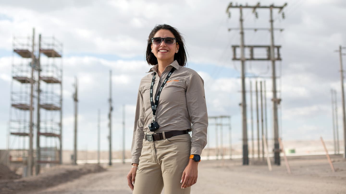 Woman in BHP uniform shown on site in Spence Chile