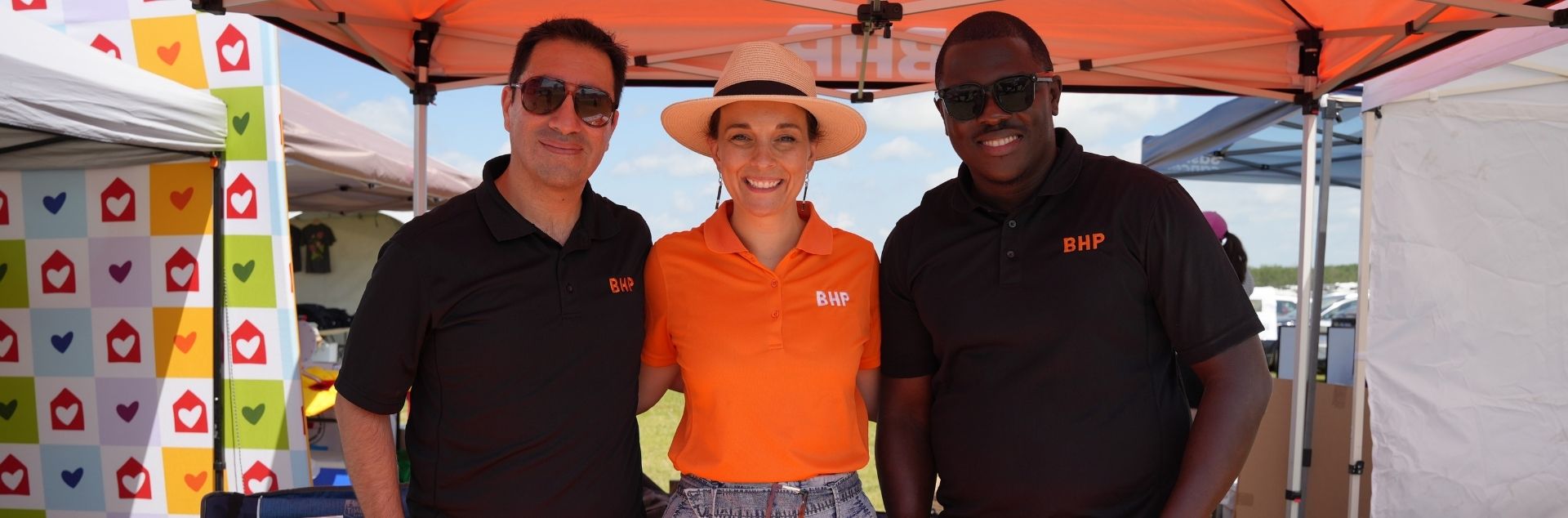Employees Alvaro Tapia, Elise Truscott and Oghosa Obazee volunteering at Back to Batoche. 